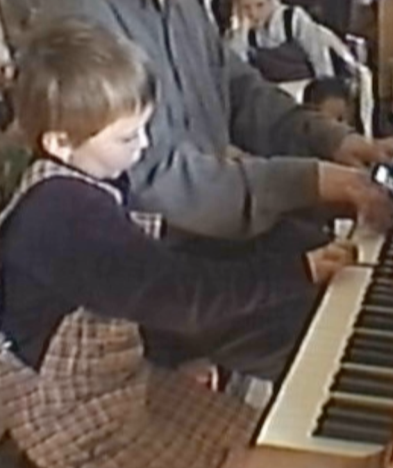 Cedric as a baby at the piano